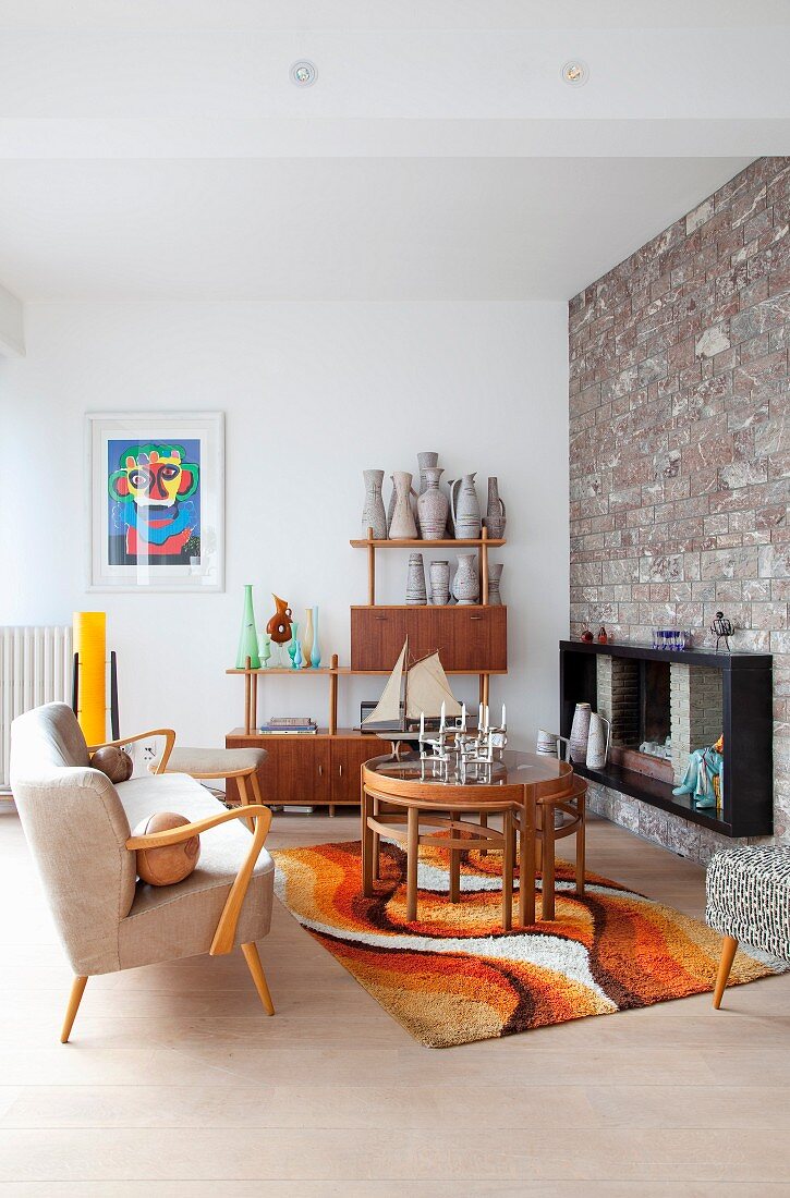 Stone wall and 70s rug in retro living room