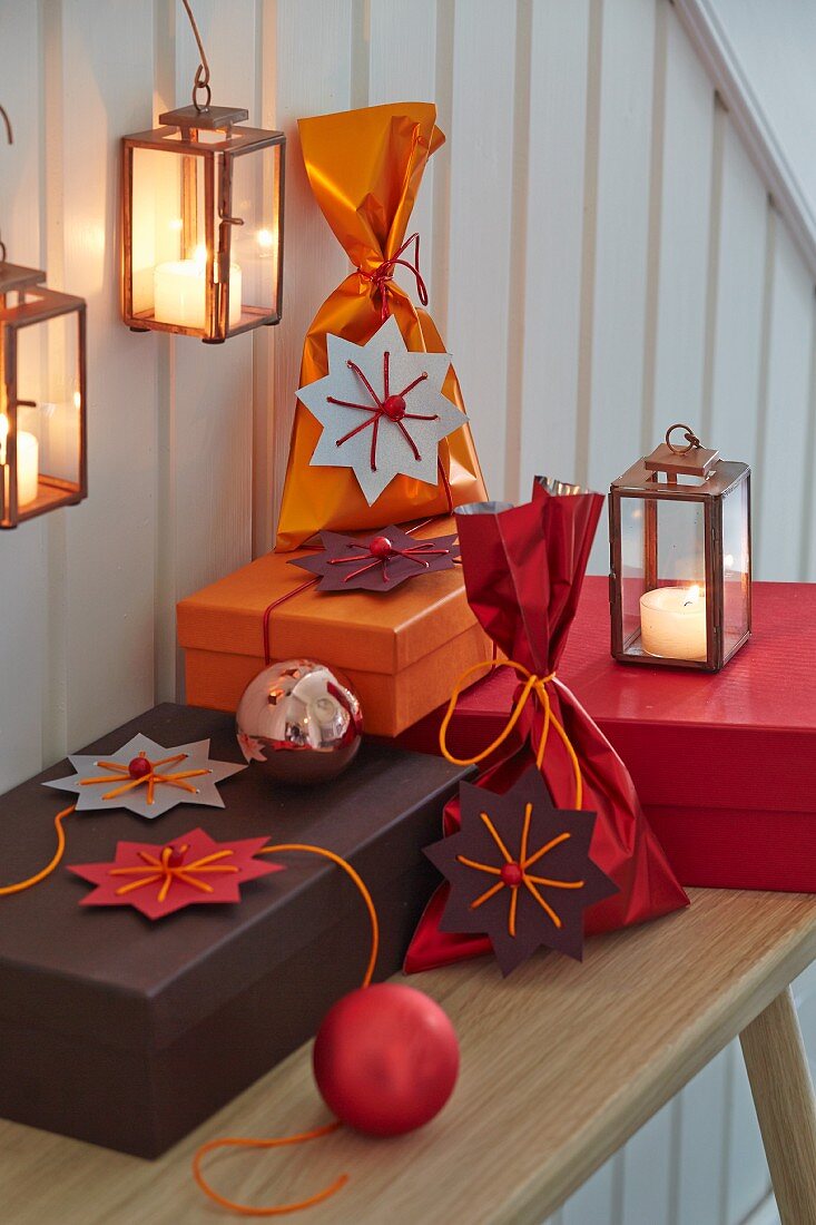 Paper stars wth string and beads as decorative gift tags