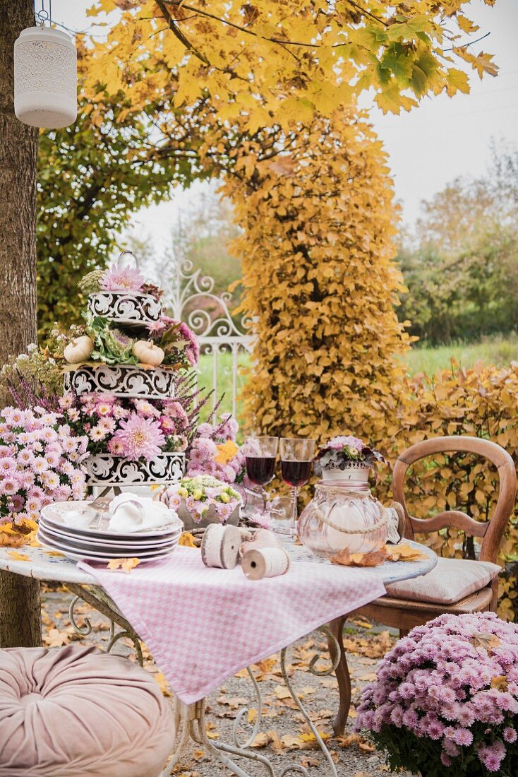 Romantically set table in autumnal garden