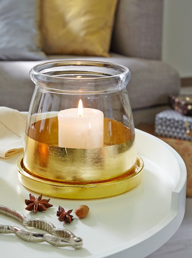 DIY – a glass container decorated with gold leaf as a candle holder