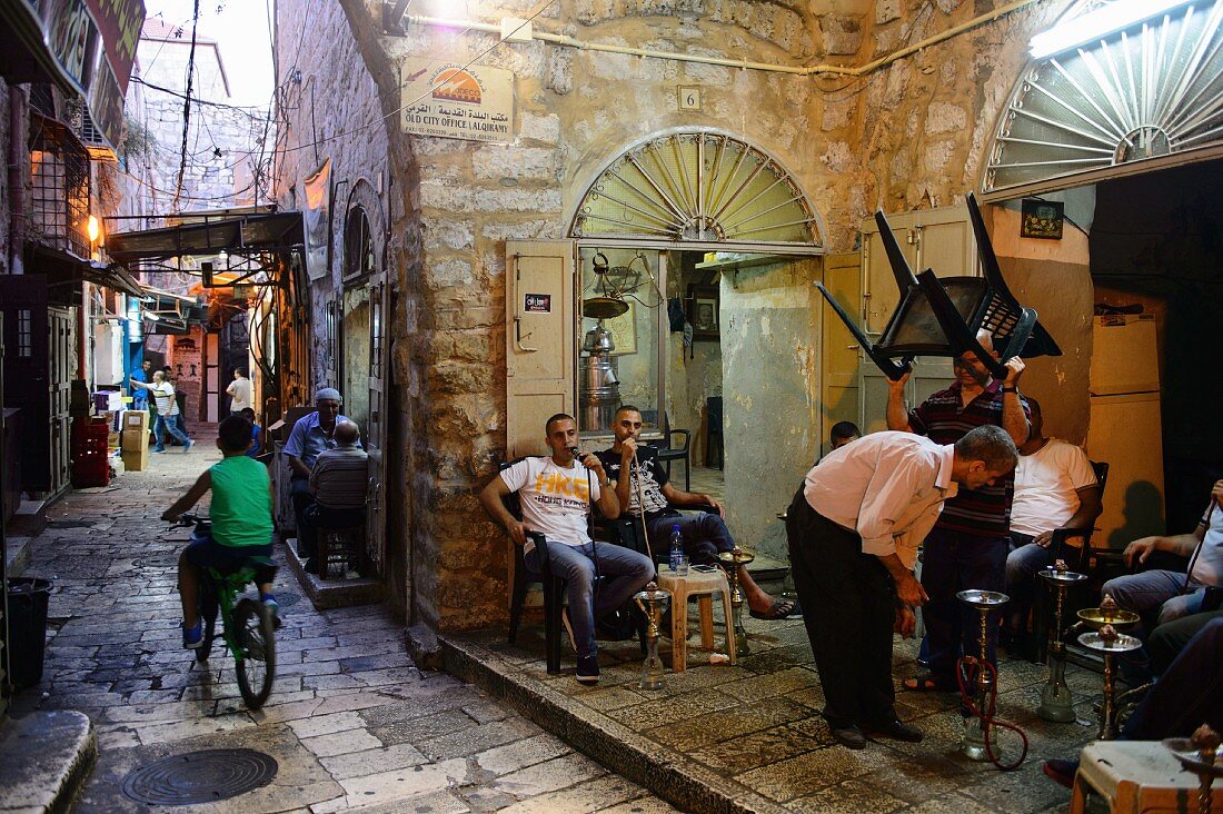 The Muslim quarter in the old town of Jerusalem, men with water pipes, Israel
