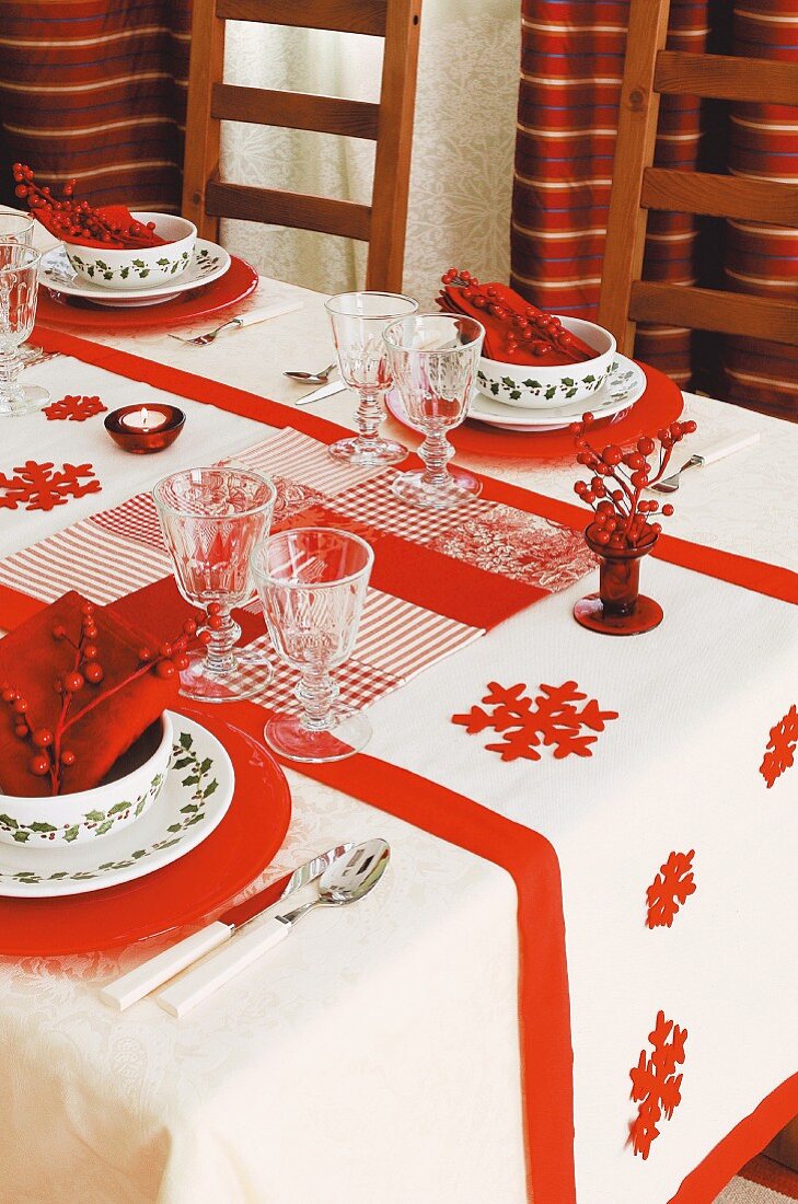 Hand-made patchwork tablecloth on festively set Christmas table