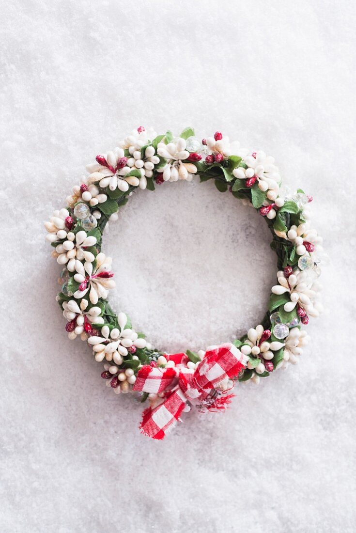 Christmas wreath with checked ribbon