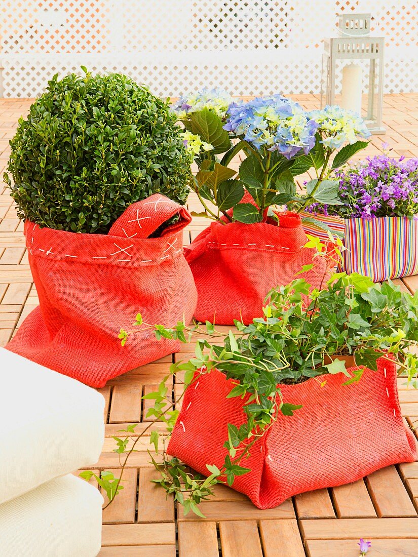 Terrace plants in decorative, hand-sewn red linen sacks