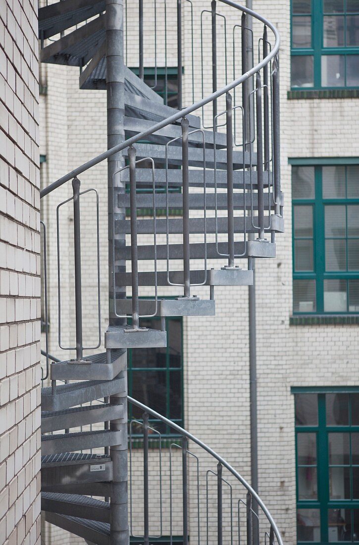 Metal spiral staircase on façade of town house