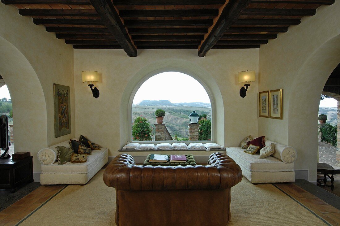 Arches and panoramic windows in Mediterranean living room