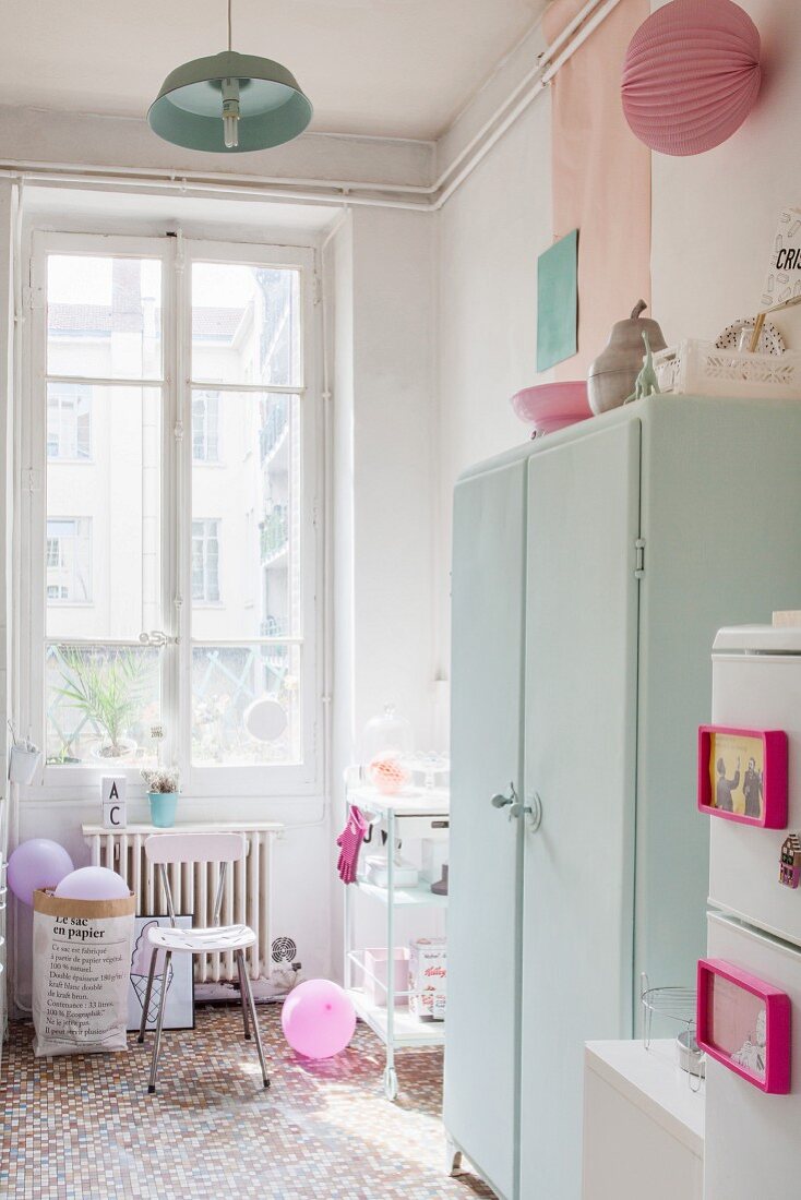 Accessories in pastel shades in kitchen of period apartment