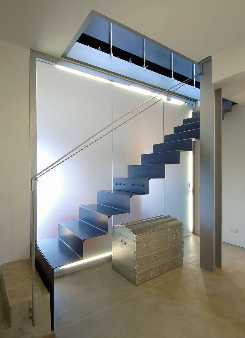 Folded steel staircase with neon lighting