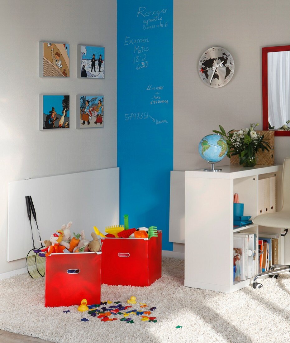 Folding table, shelves and blue chalkboard stripe in play area