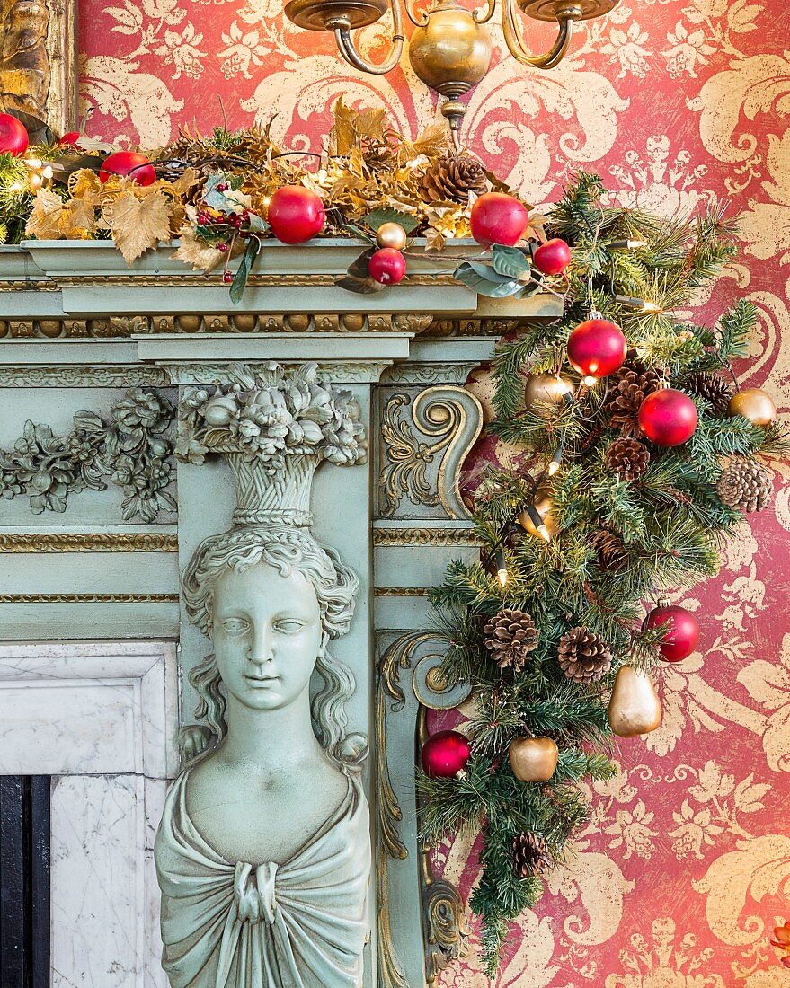 Lavishly ornamented fire surround decorated with festive garland
