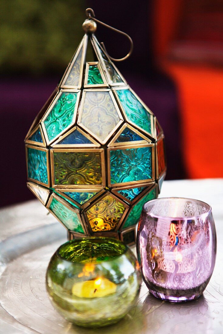 Oriental-style candle lanterns made from glass of various colours