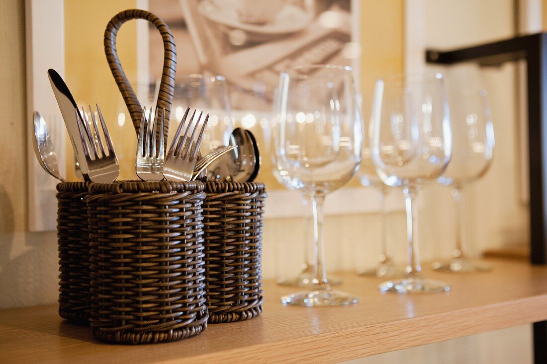 Close-up of cutlery and wine glasses on shelf; San Marcos; California; USA