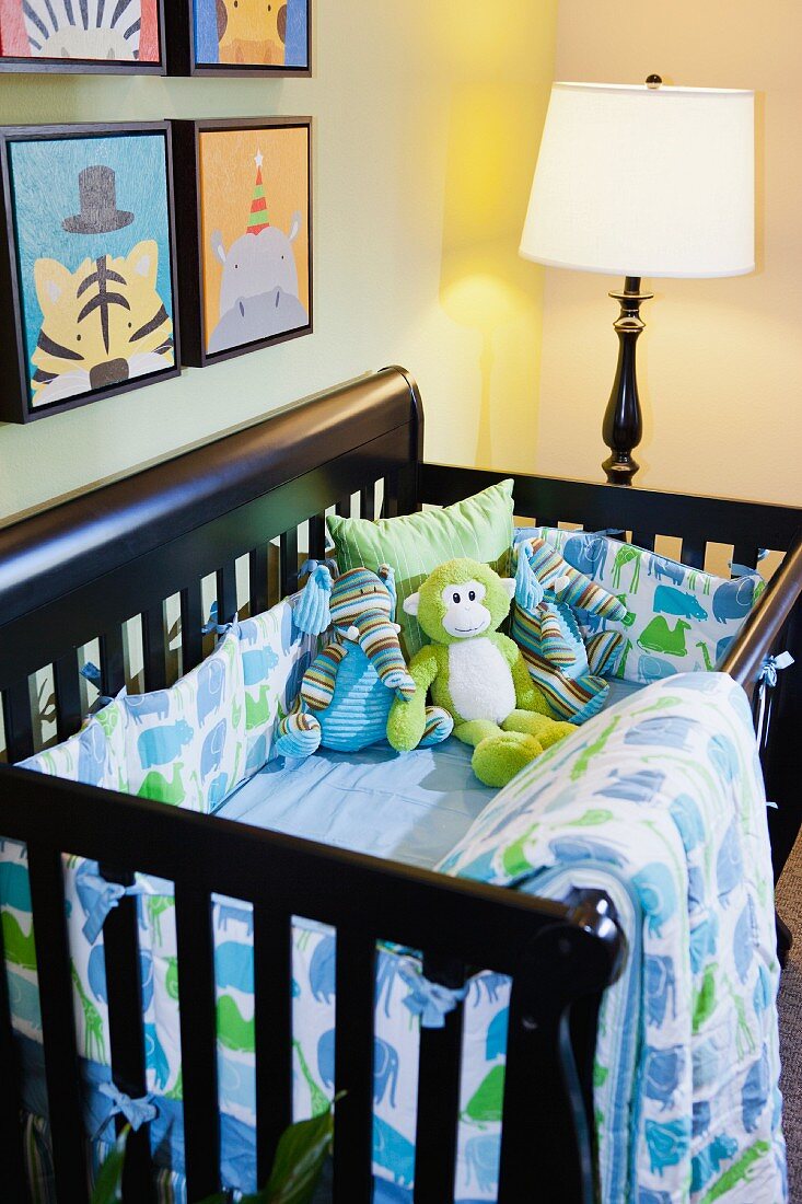 Soft toys in crib in nursery; Azusa; California; USA