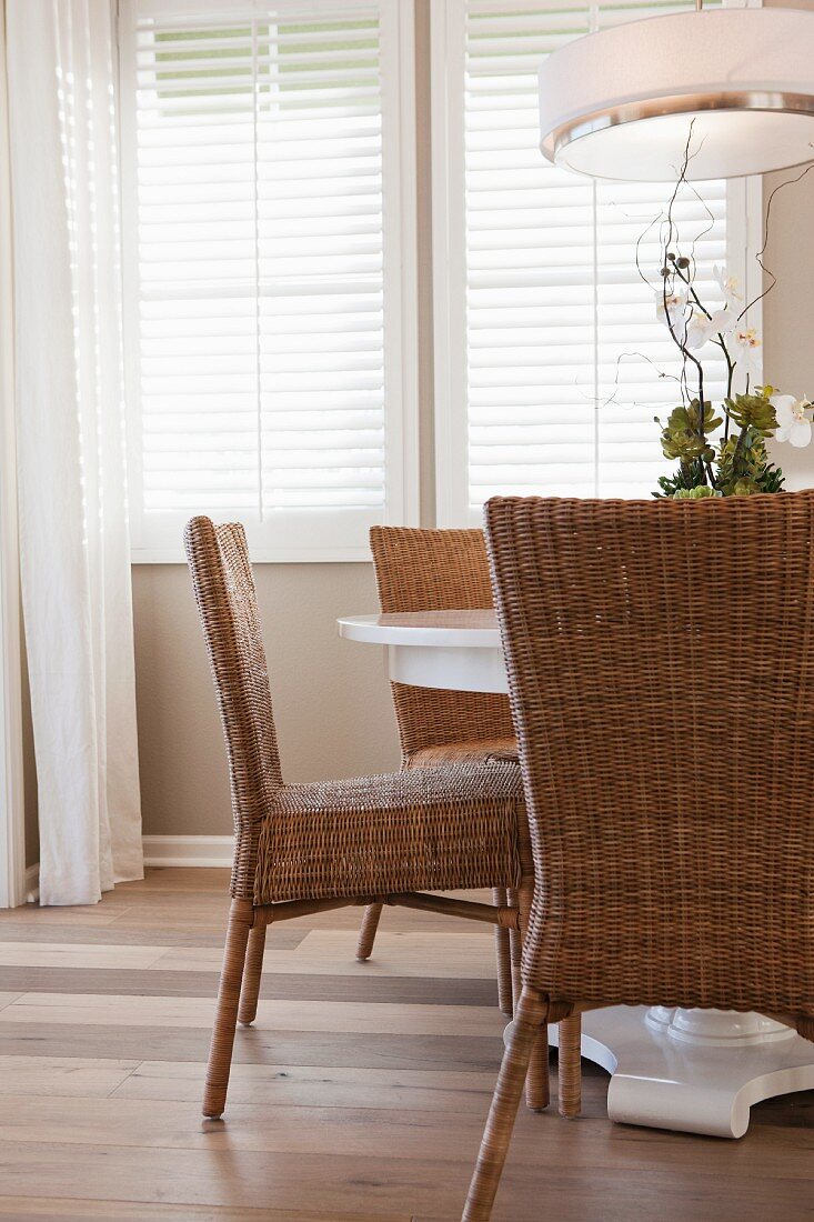 Wicker chairs at dining table