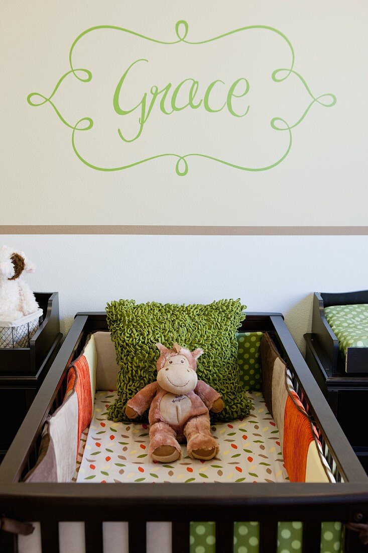 Soft toy in crib in nursery; Valencia; California; USA