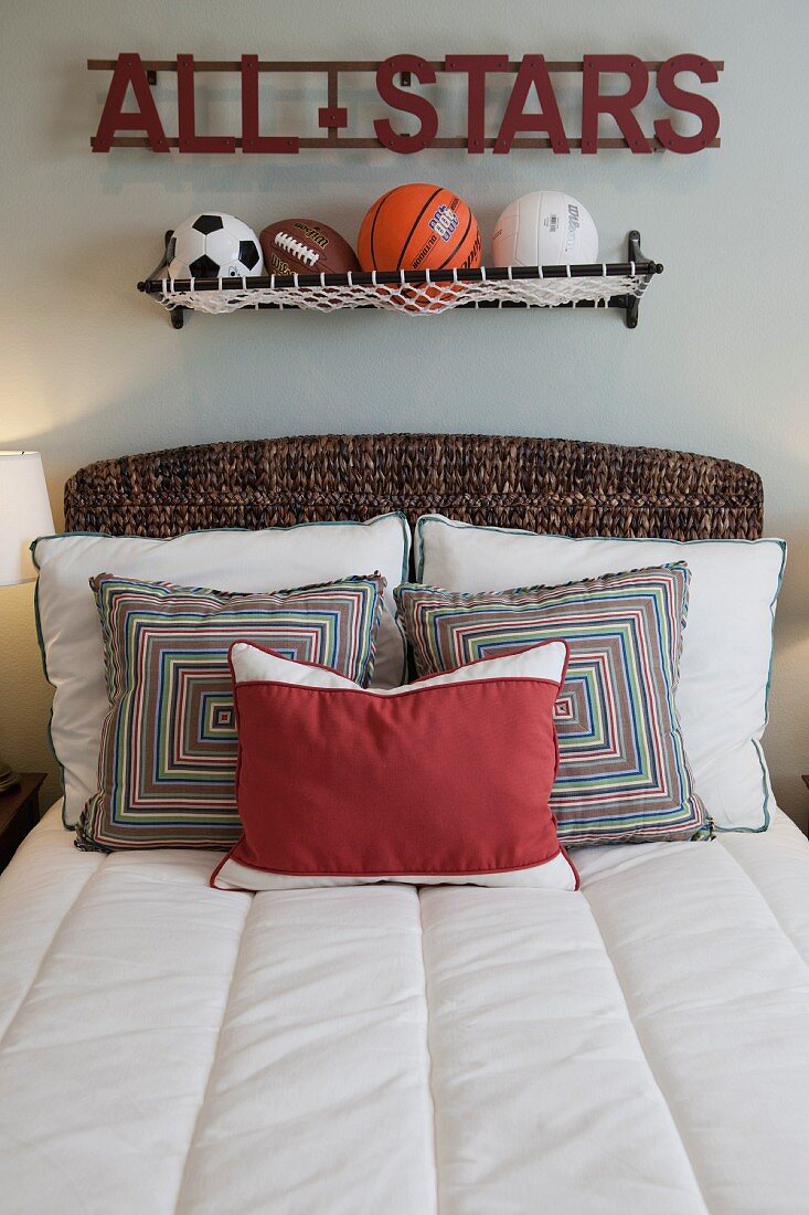 Balls above bed with scatter cushions