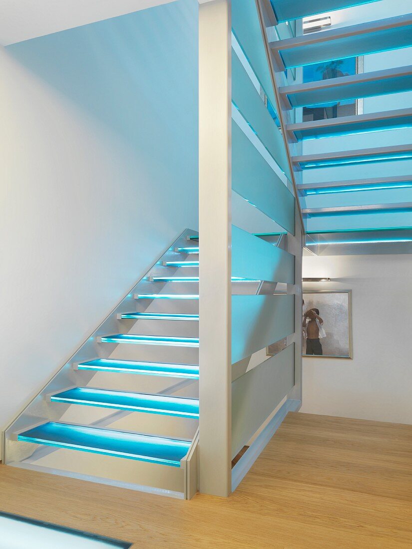 Wooden stairs with blue illuminated treads; Scottsdale; USA