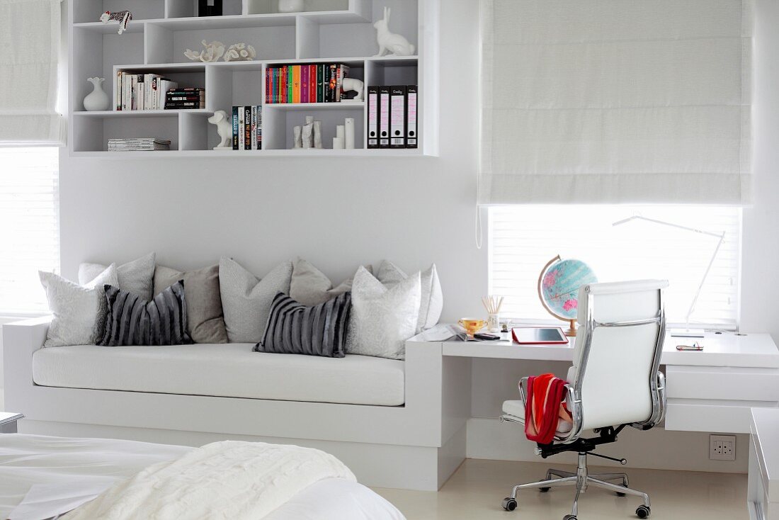 Fitted couch and desk as space-saving solution in white, teenager's bedroom