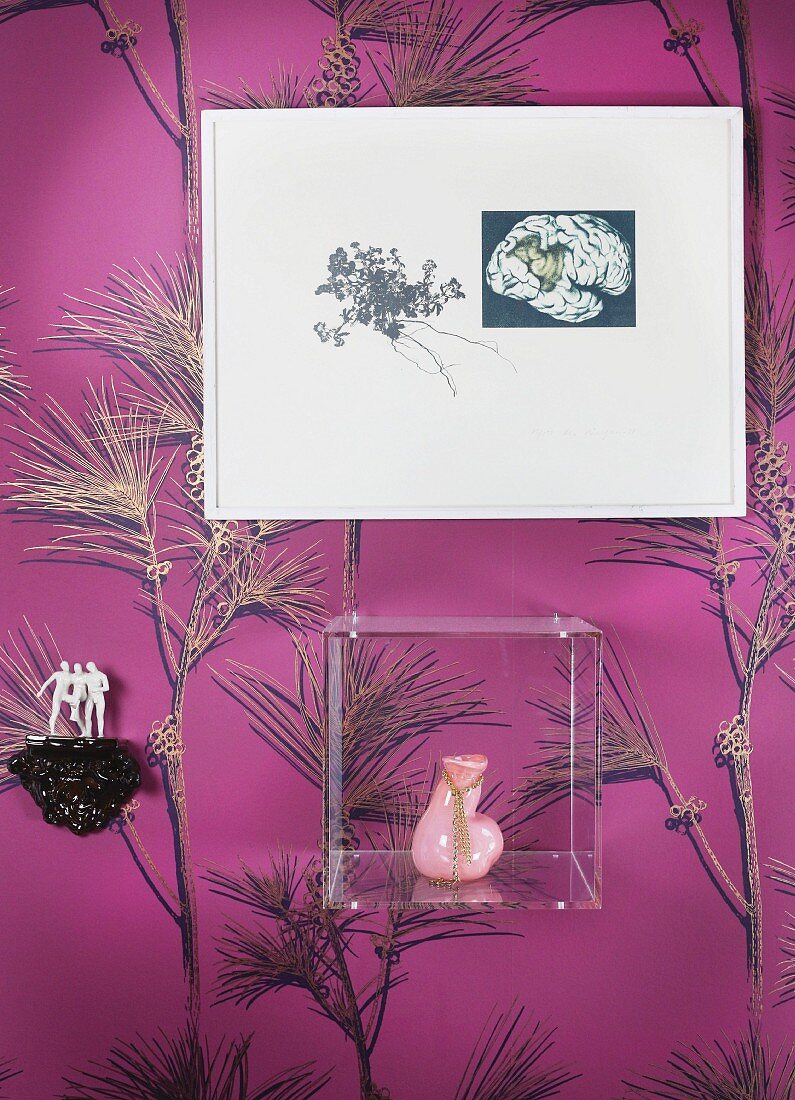 Ceramic sculpture, plexiglas box and picture on wall with mauve wallpaper