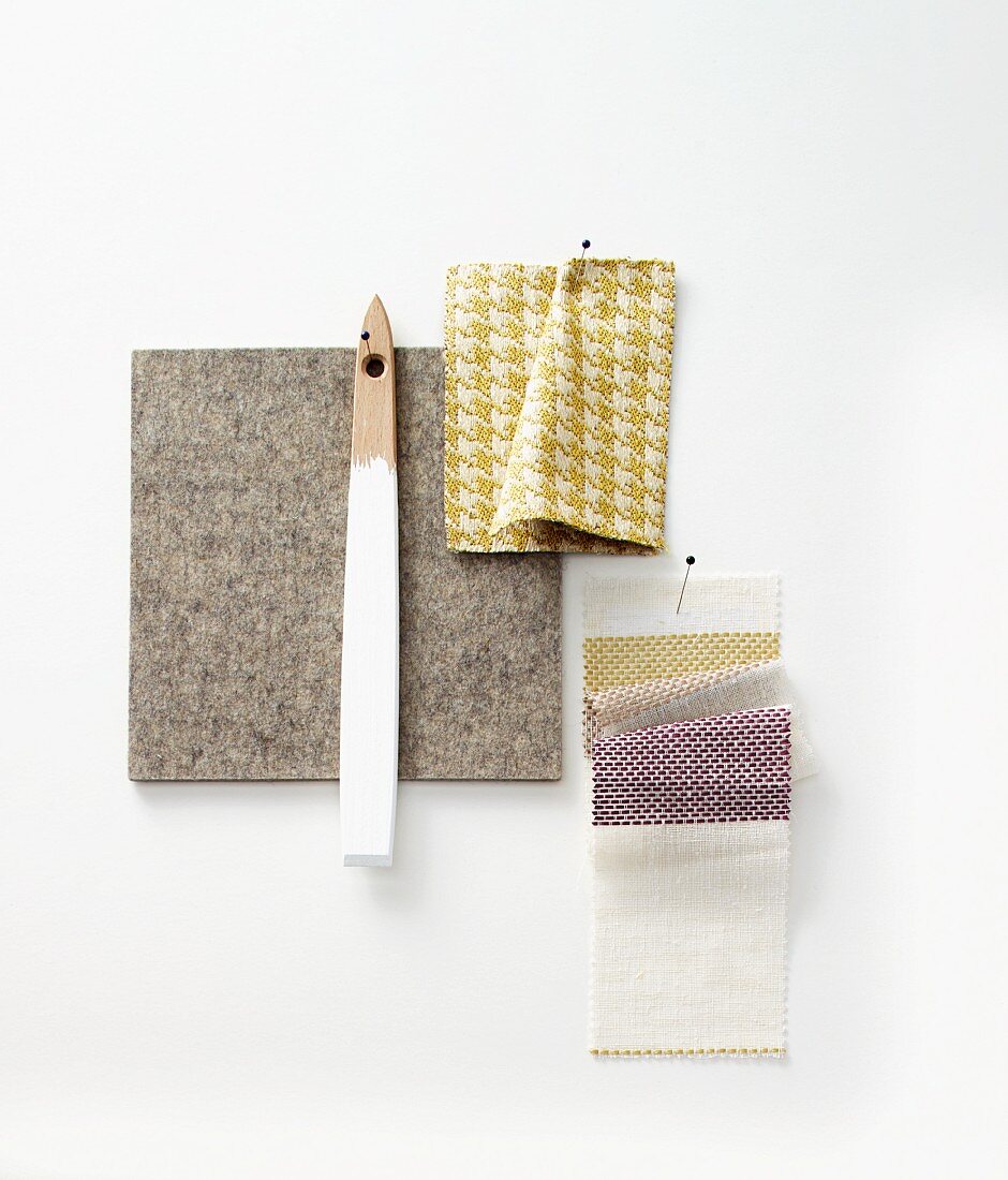 Various fabric samples and a piece of grey felt