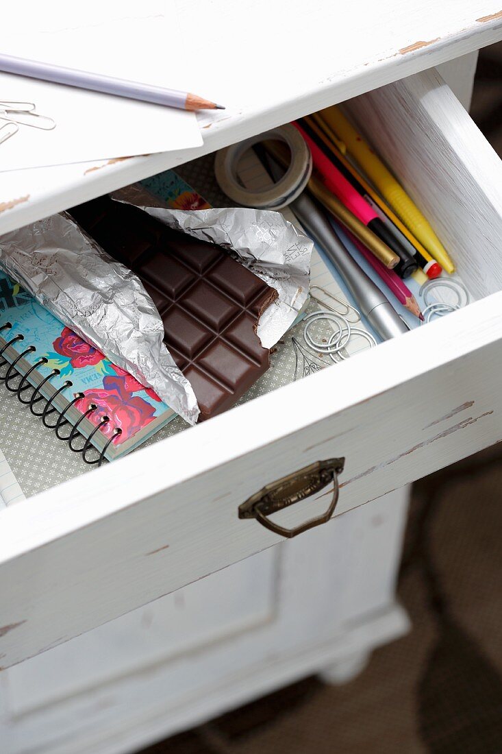 A view of a bar of chocolate in an open drawer
