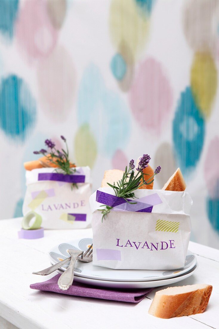 Small bag of bread with sprig of lavender decorating place setting