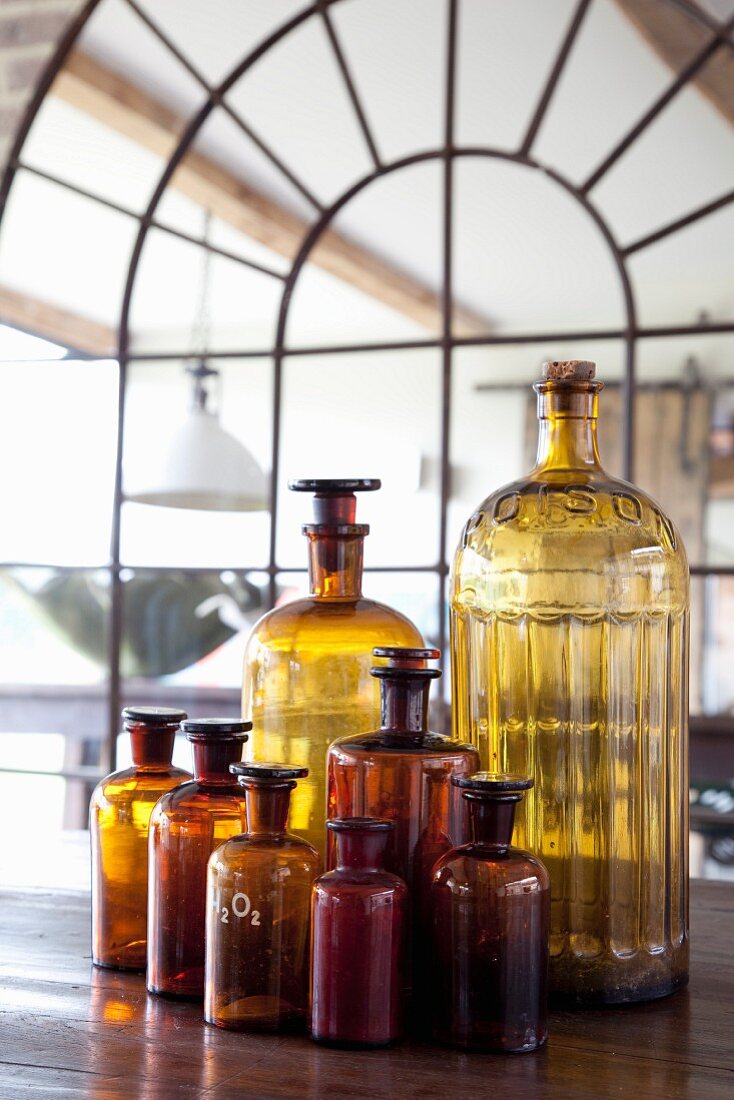 Vintage apothecary bottles of various sizes