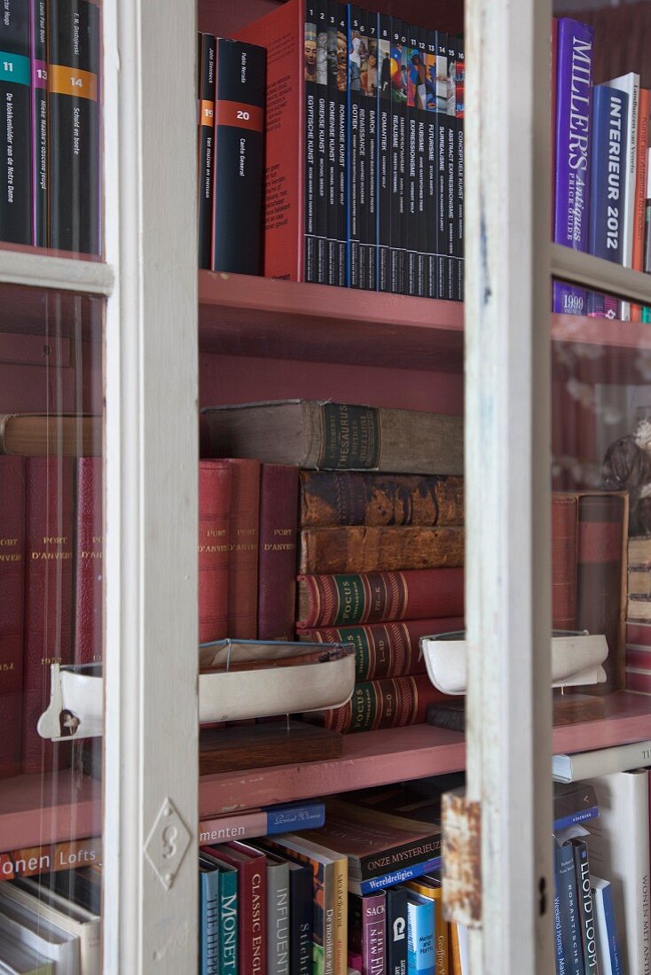 Antiquarian books in glass-fronted cabinet