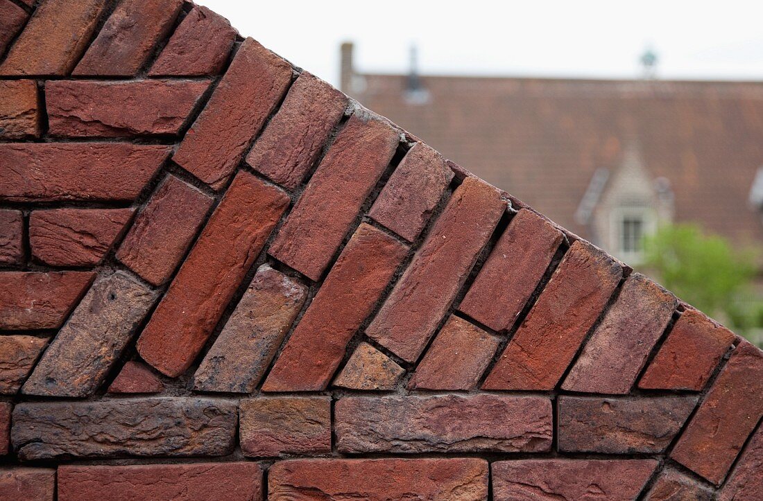 Detail of angled, brick garden wall