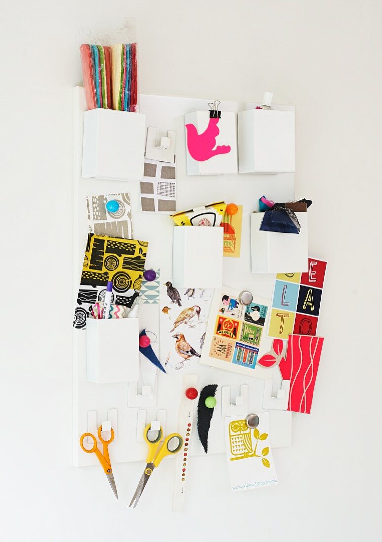 Mood board with postcards and office utensils