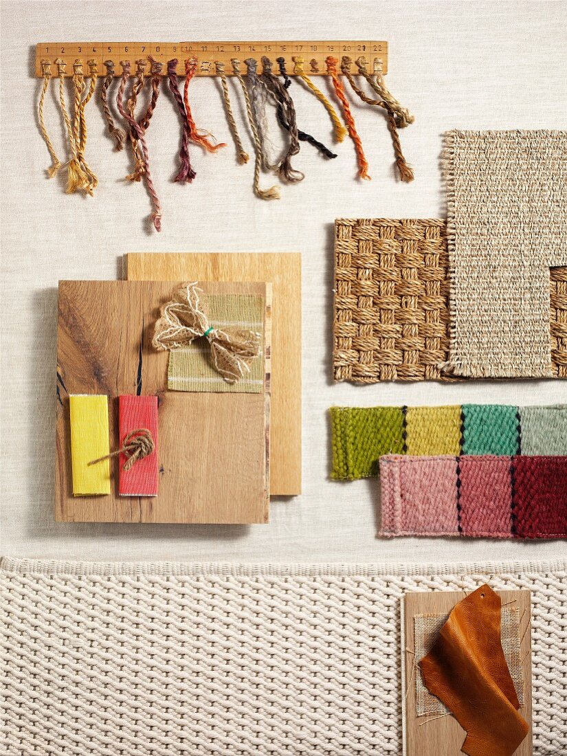 Interior design samples of various fabrics, sisal and wood