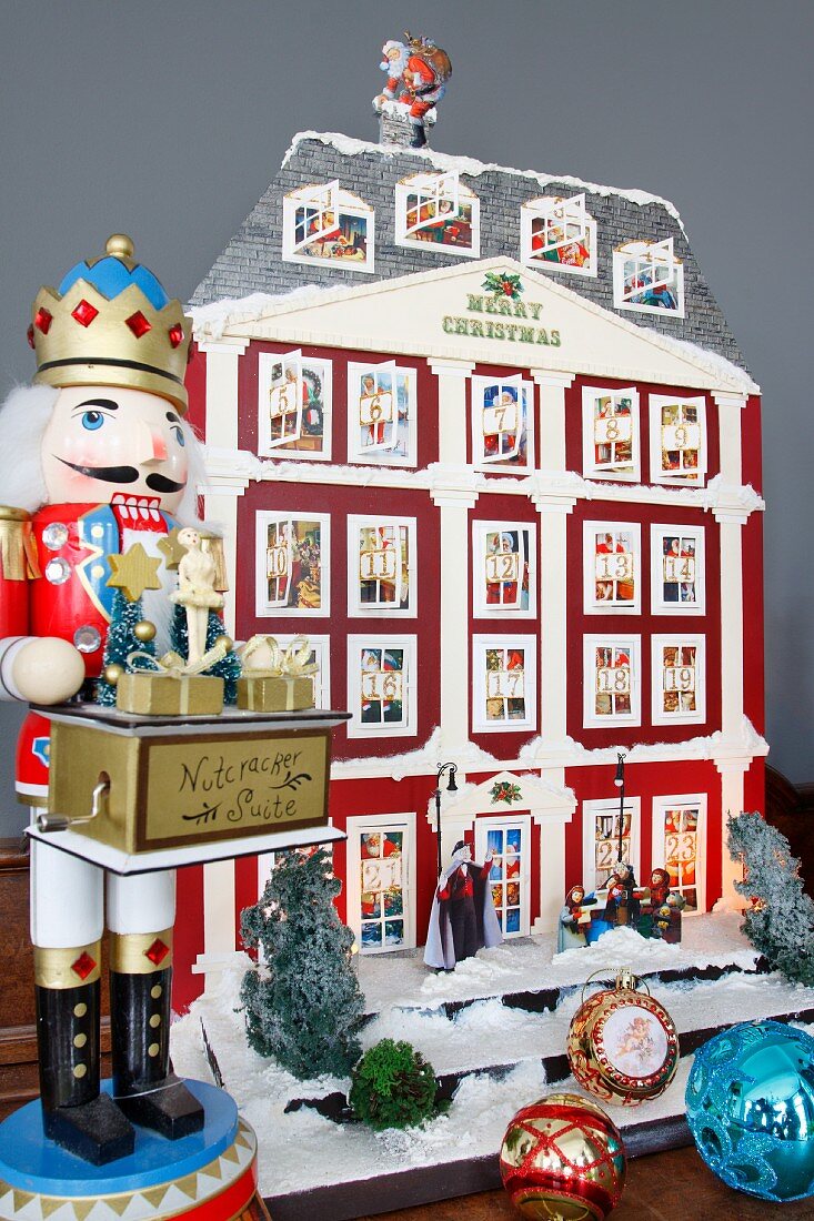 Traditional Hussar nutcracker and house-shaped Advent calender