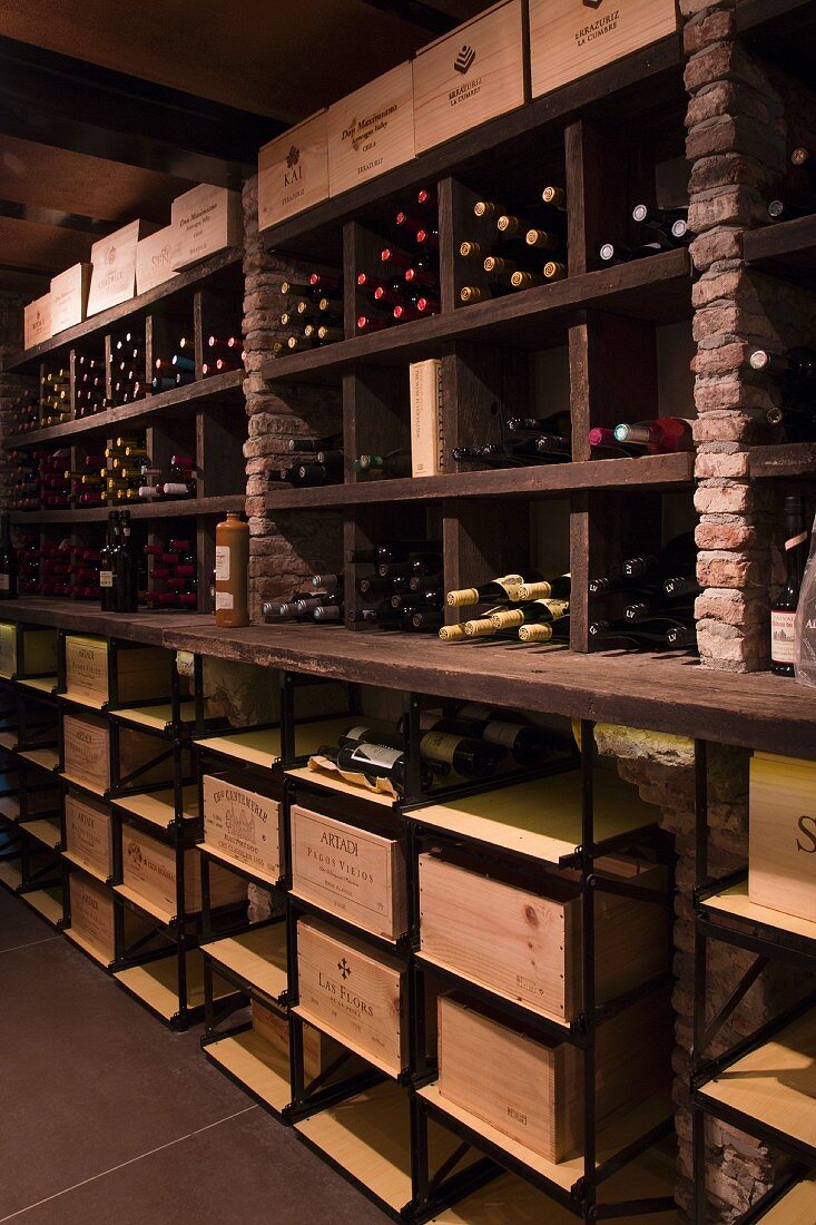 Wood and stone shelving in rustic wine cellar
