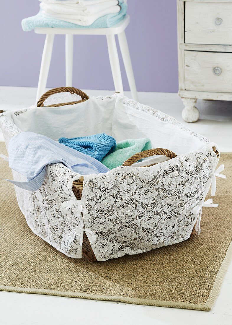 A washing basket decorated with lace