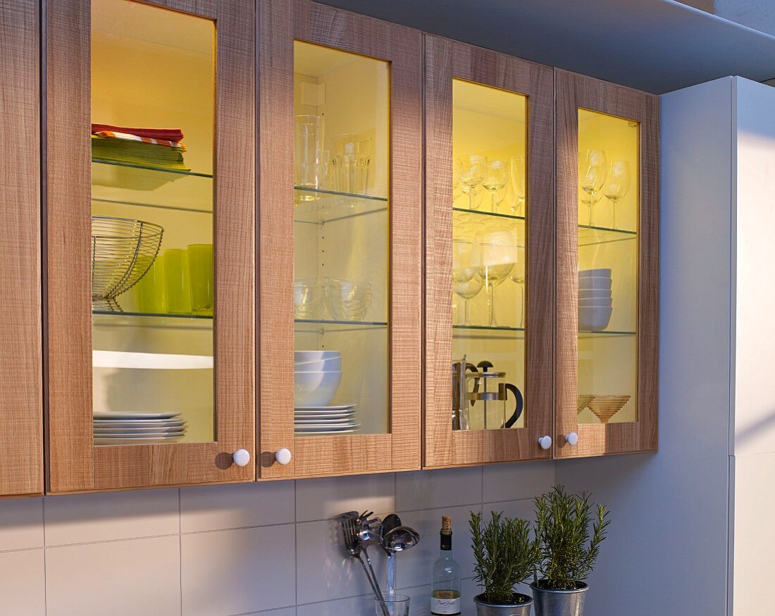 Kitchen cabinet doors refurbished with wood and glasss panels with illuminated interiors