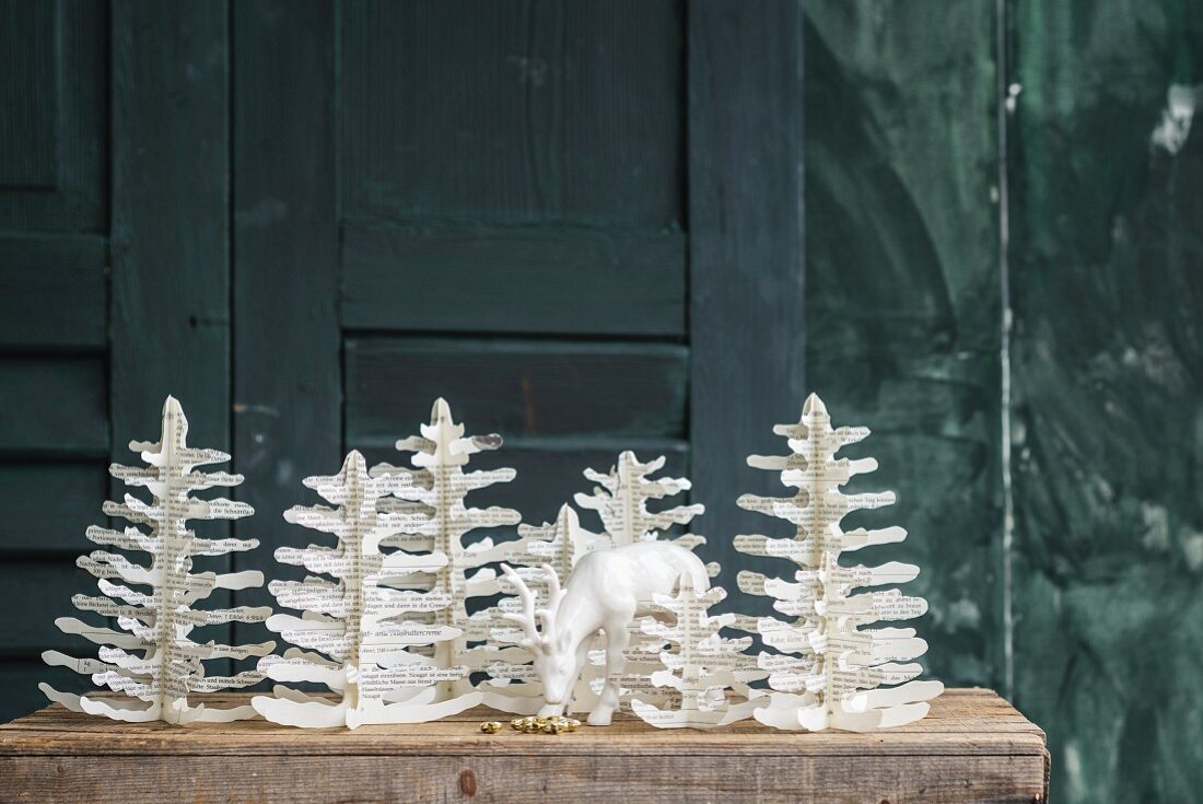 Hand-crafted woodland of paper fir trees made from pages of old books