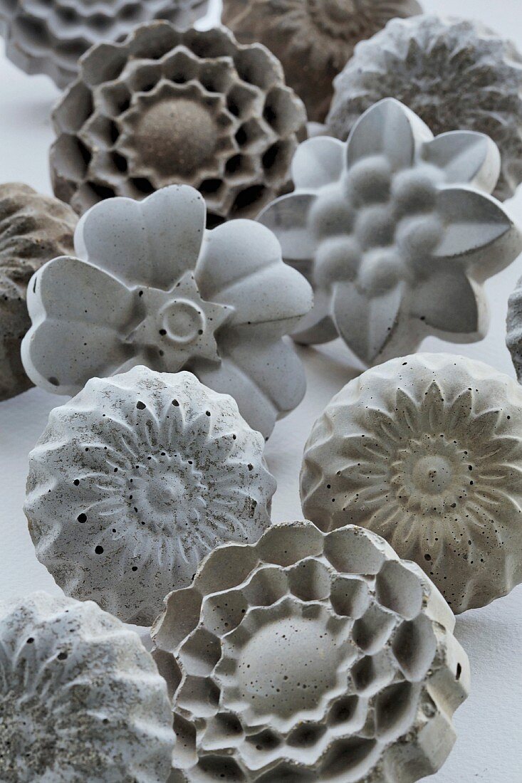 Concrete furniture knobs in various floral shapes