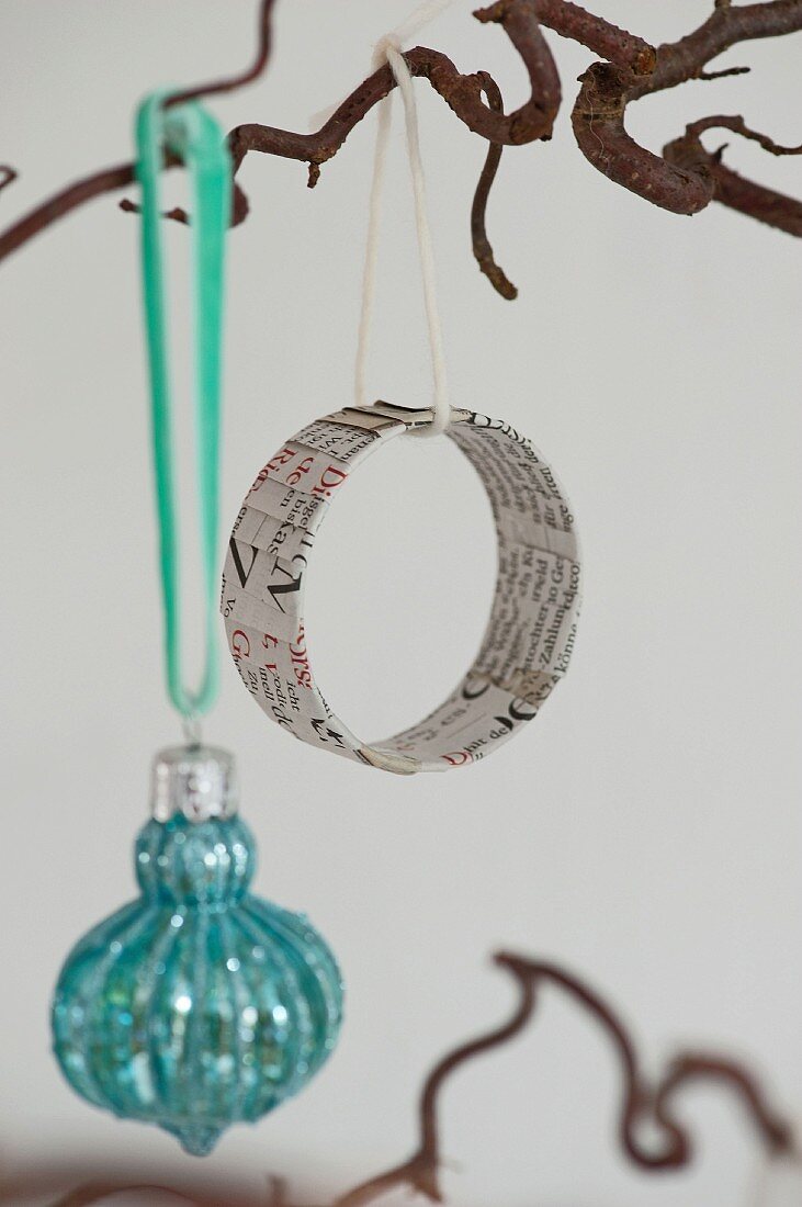 Circular Christmas-tree decoration made from old newspaper