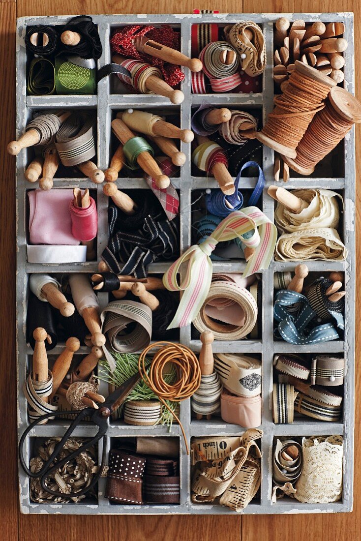 Vintage-style wooden case of organised ribbons