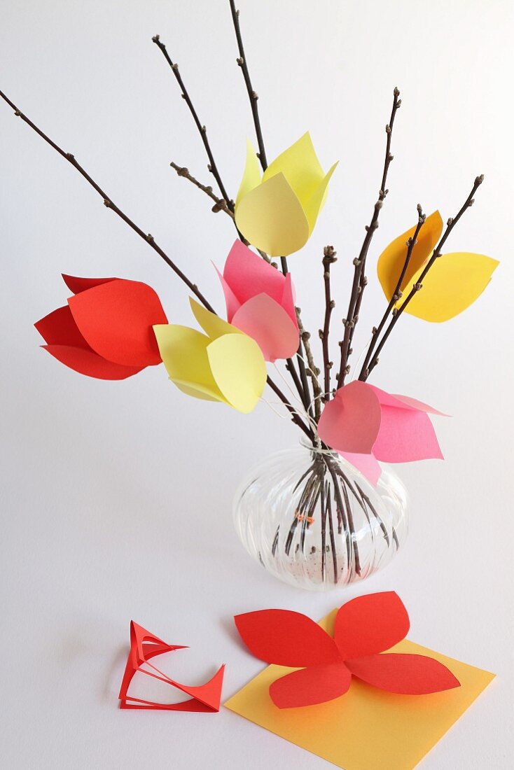 Vase of hand-crafted tulips made from paper and twigs