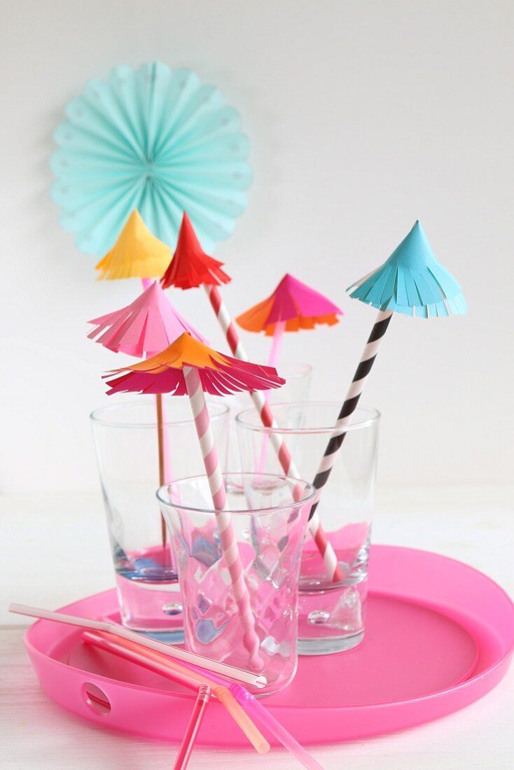Hand-crafted paper umbrellas as decorations for party drinks