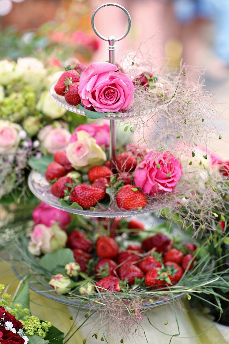 Strawberries and roses on cake stand