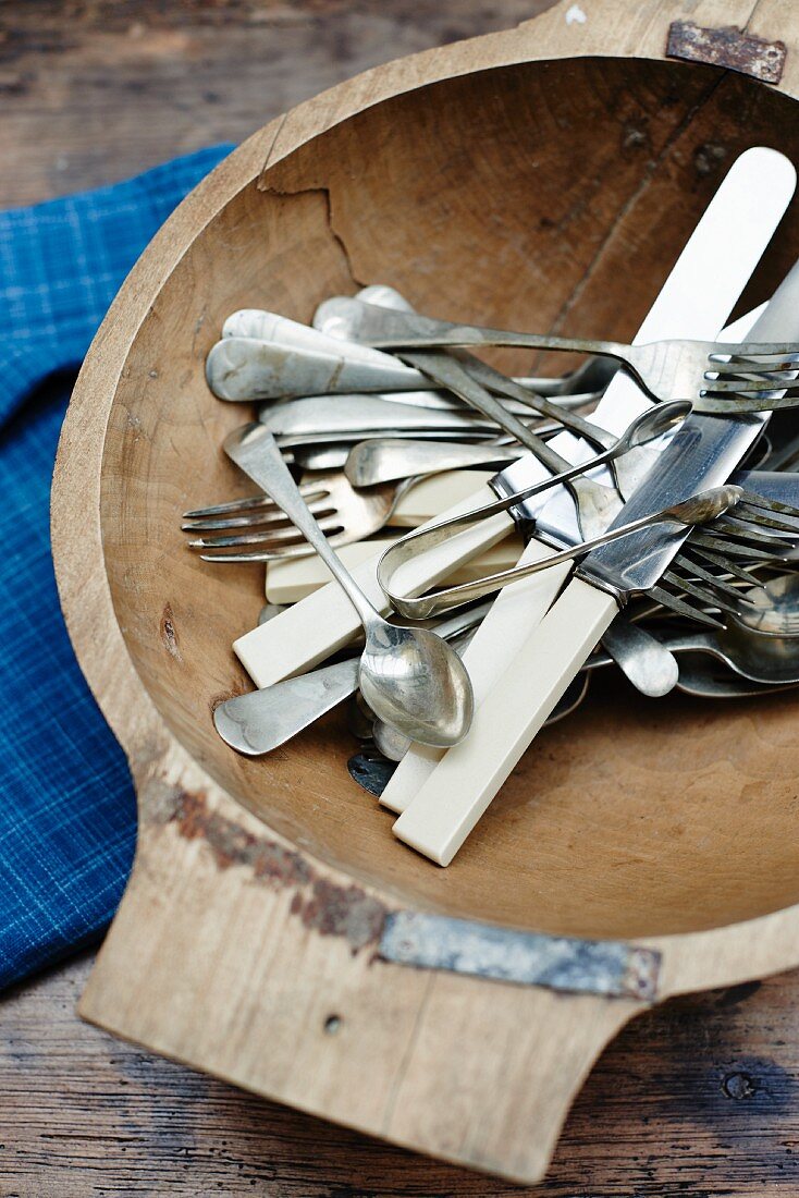 Wooden bowl of vintage cutlery