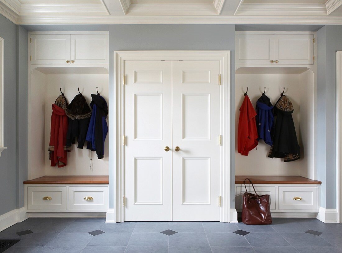 Symmetrical, fitted cloakroom in elegant, country-house style