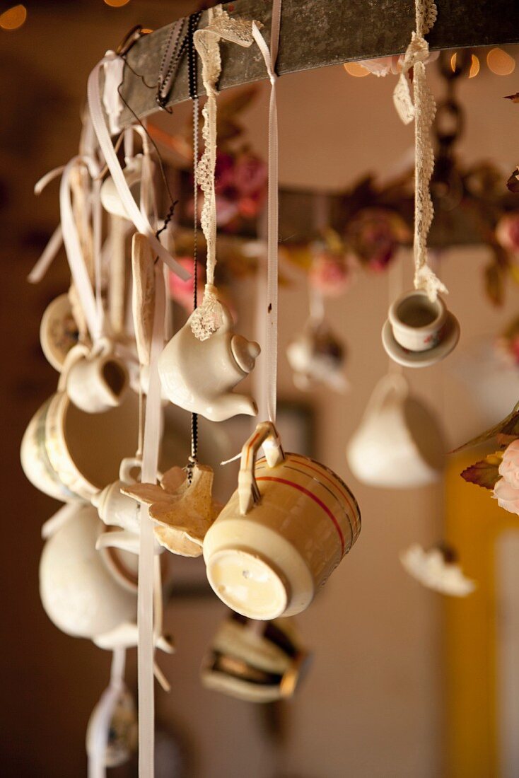 Crockery ornaments hung from suspended metal ring