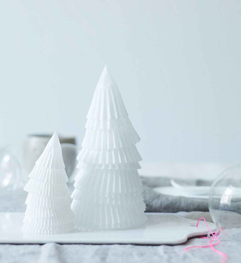 White paper cones stacked to make small Christmas tree
