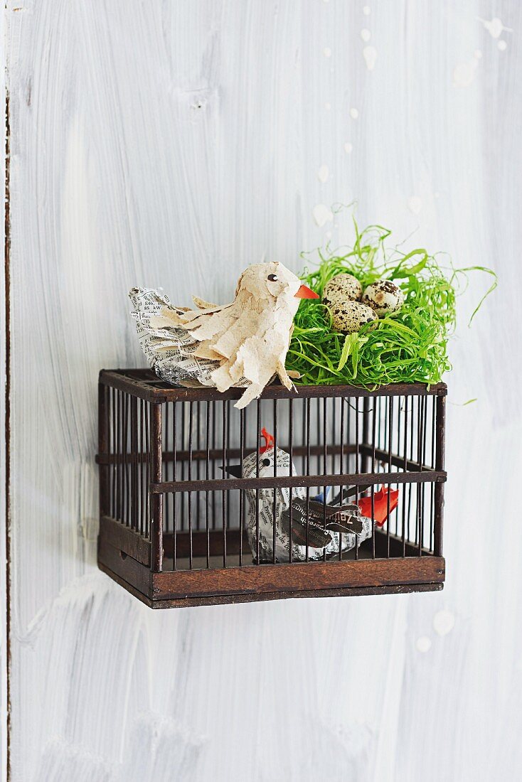 Bird ornaments hand-crafted from tin foil and paper strips as spring decoration