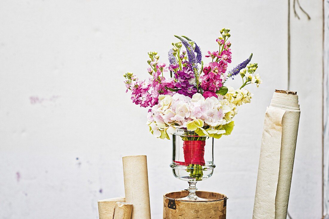 Summer bouquet of hydrangeas, stocks & speedwell in glass vase