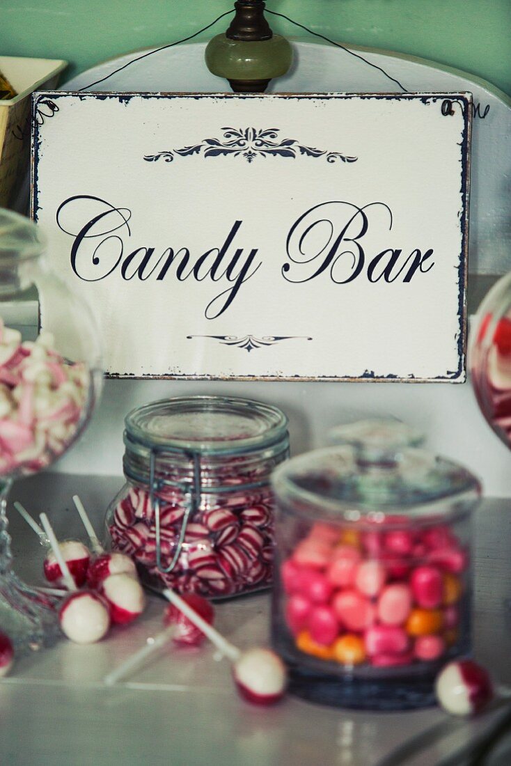 Candy buffet bar with vintage enamel sign