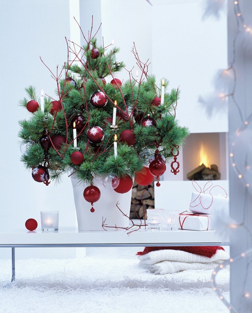 Christmas tree decorated with red baubles and twigs